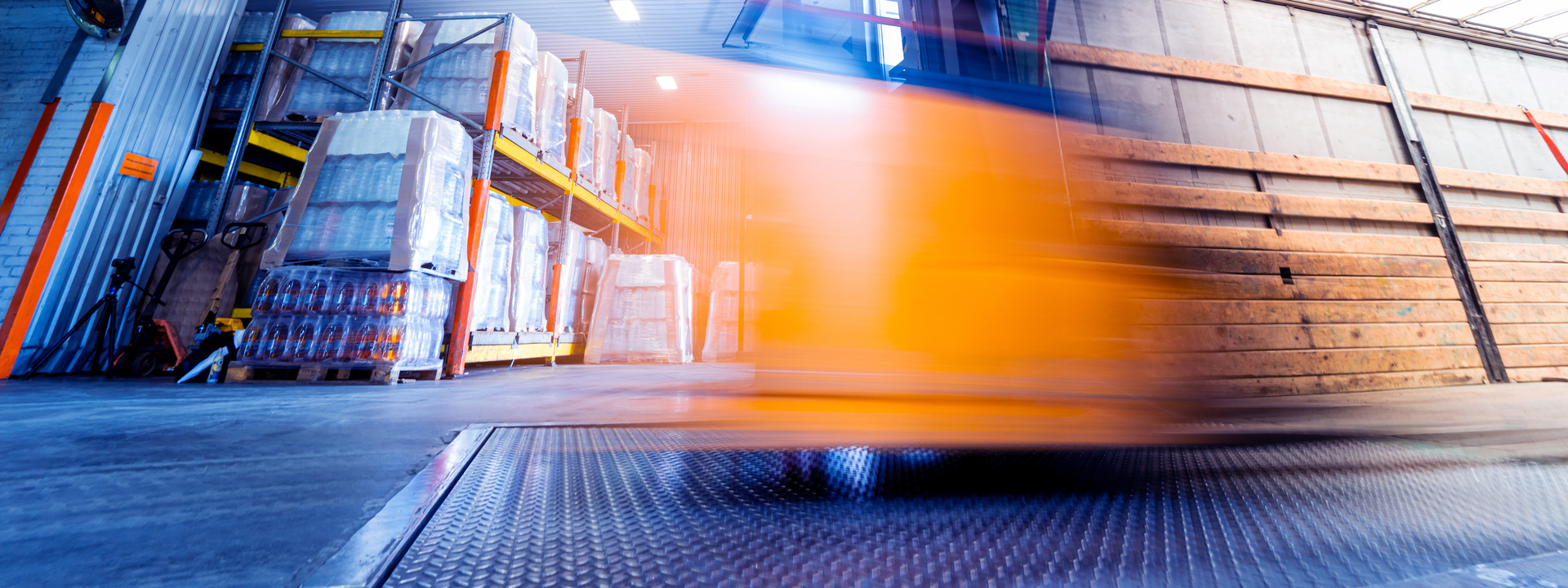 Forklift loader working at beverages plant warehouse