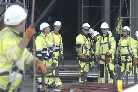 Group of people standing in a industrial environment 